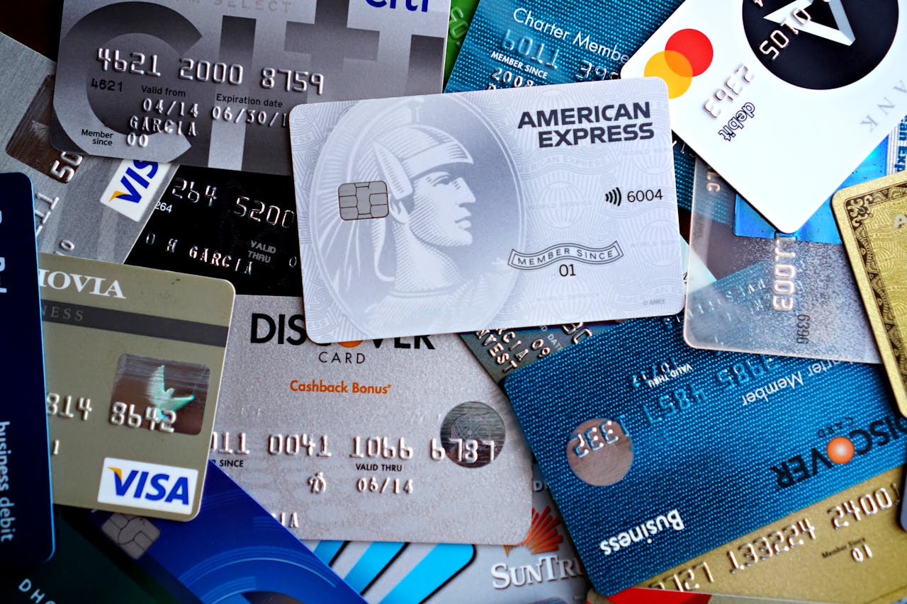 about-04 Close-up image of various credit and debit cards including Visa, MasterCard, American Express, and Discover.